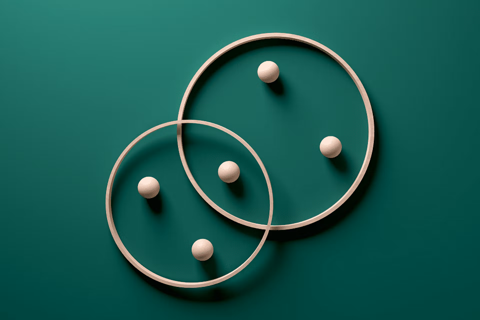 A pair of wooden circles, each topped with two balls, creating a balanced and visually appealing arrangement.
