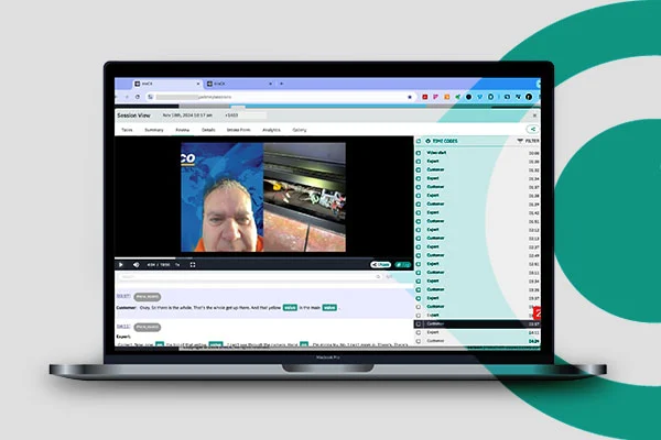 A laptop with a video playing on its screen, capturing attention with colorful imagery and active scenes.
